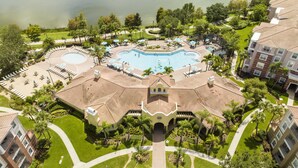 A resort with a central pool, multiple lounge areas, and a well-maintained garden. - Location,Location,Orlando3bdr 2bthl,Resort near all parks, Conv.Ctr, Int. Dr (Orlando)