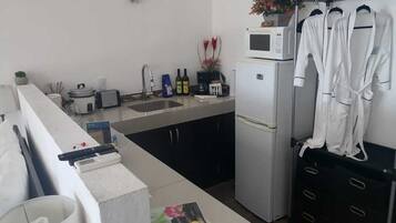 Fridge, microwave, stovetop, coffee/tea maker
