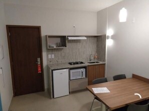 Fridge, microwave, stovetop, cookware/dishes/utensils