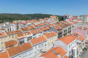 Explore a vibrant urban neighborhood with a mix of residential and commercial buildings.