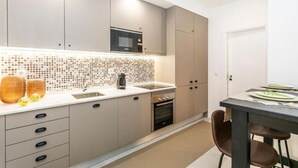 Coffee/tea maker, fridge, microwave, oven - Lively 2 Bedroom Apartment in Iconic Alfama by Lisbeyond (Lisboa)