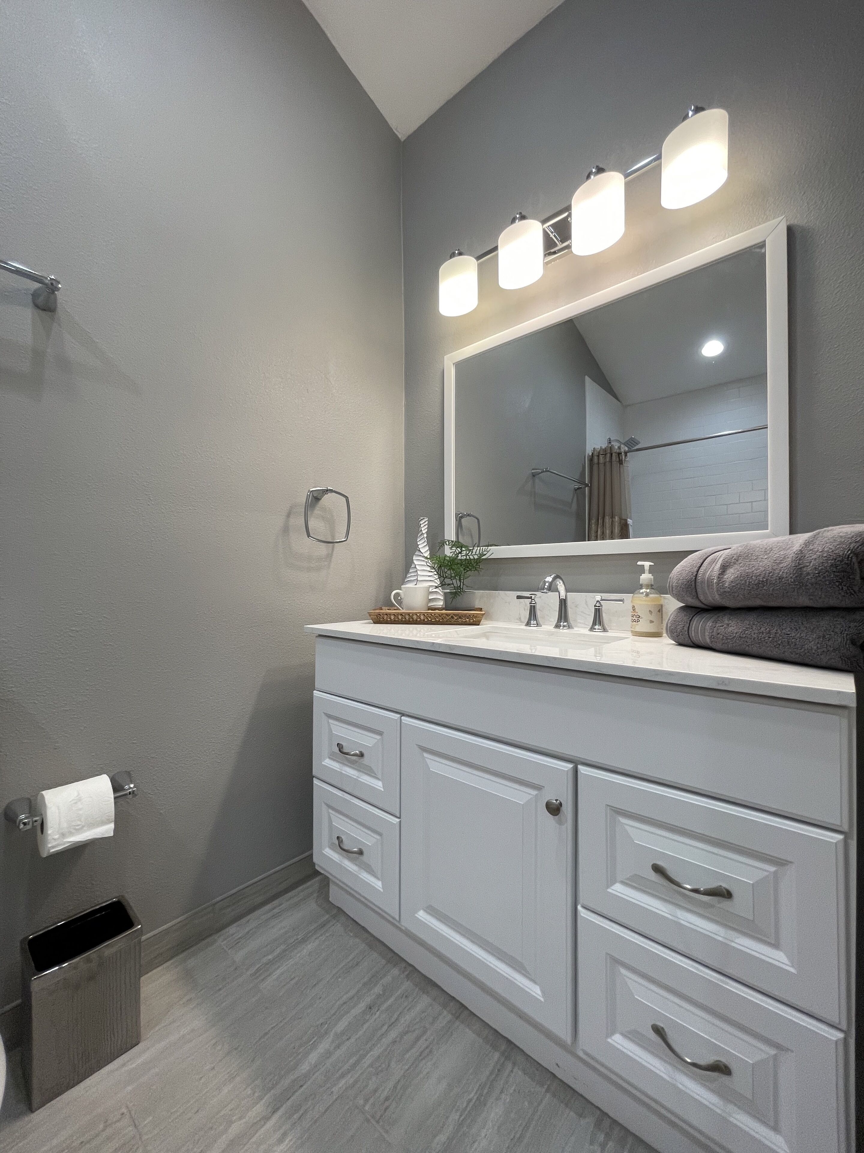 Combined shower/tub, hair dryer, towels, soap