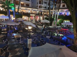 Guests can dine al fresco under the shade of palm trees and umbrellas.