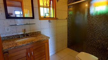 Shower, hair dryer, towels, toilet paper