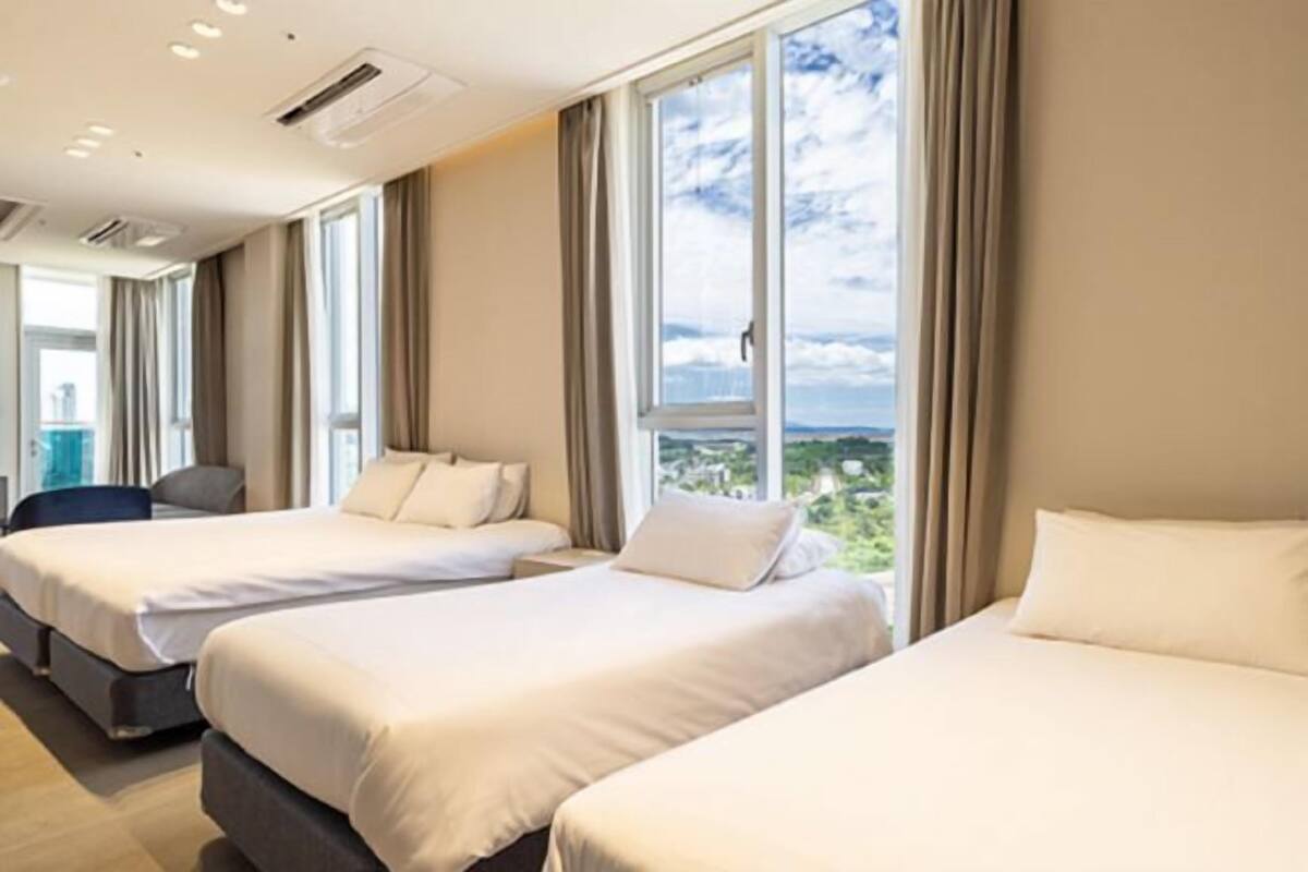 Select Comfort beds, desk, laptop workspace, blackout curtains