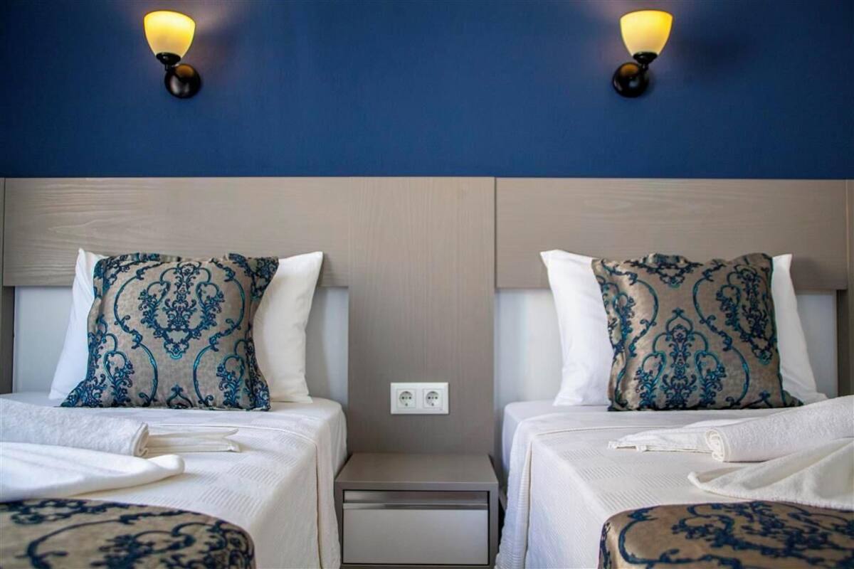 Twin Room, Balcony, Partial Sea View | Desk, laptop workspace, WiFi (free), bed sheets