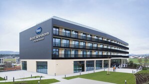 A modern Best Western Parkhotel building with a flat roof, multiple balconies, and a well-maintained lawn area. - Best Western Parkhotel Hagenberg (Hagenberg im Mühlkreis)