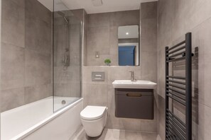 Bathtub, free toiletries, hair dryer, towels