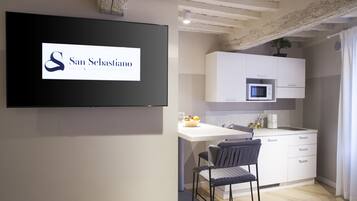 Fridge, microwave, stovetop, coffee/tea maker