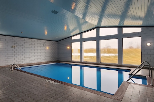 Indoor pool, open 6:00 AM to 10:00 PM, sun loungers