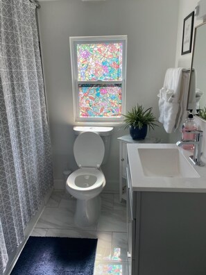 Bathtub, hair dryer, towels, soap