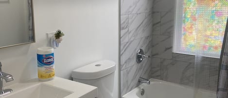 Bathtub, hair dryer, towels, soap