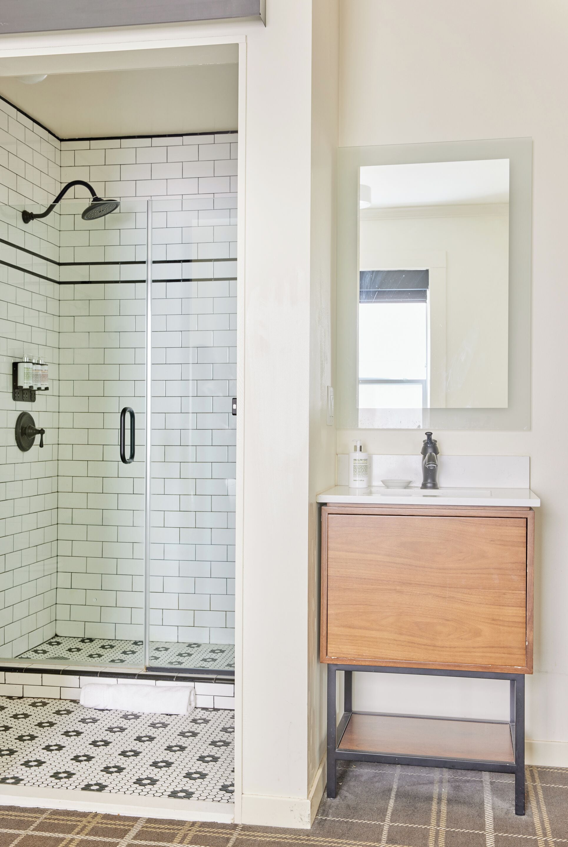 shower, designer toiletries, hair dryer, towels