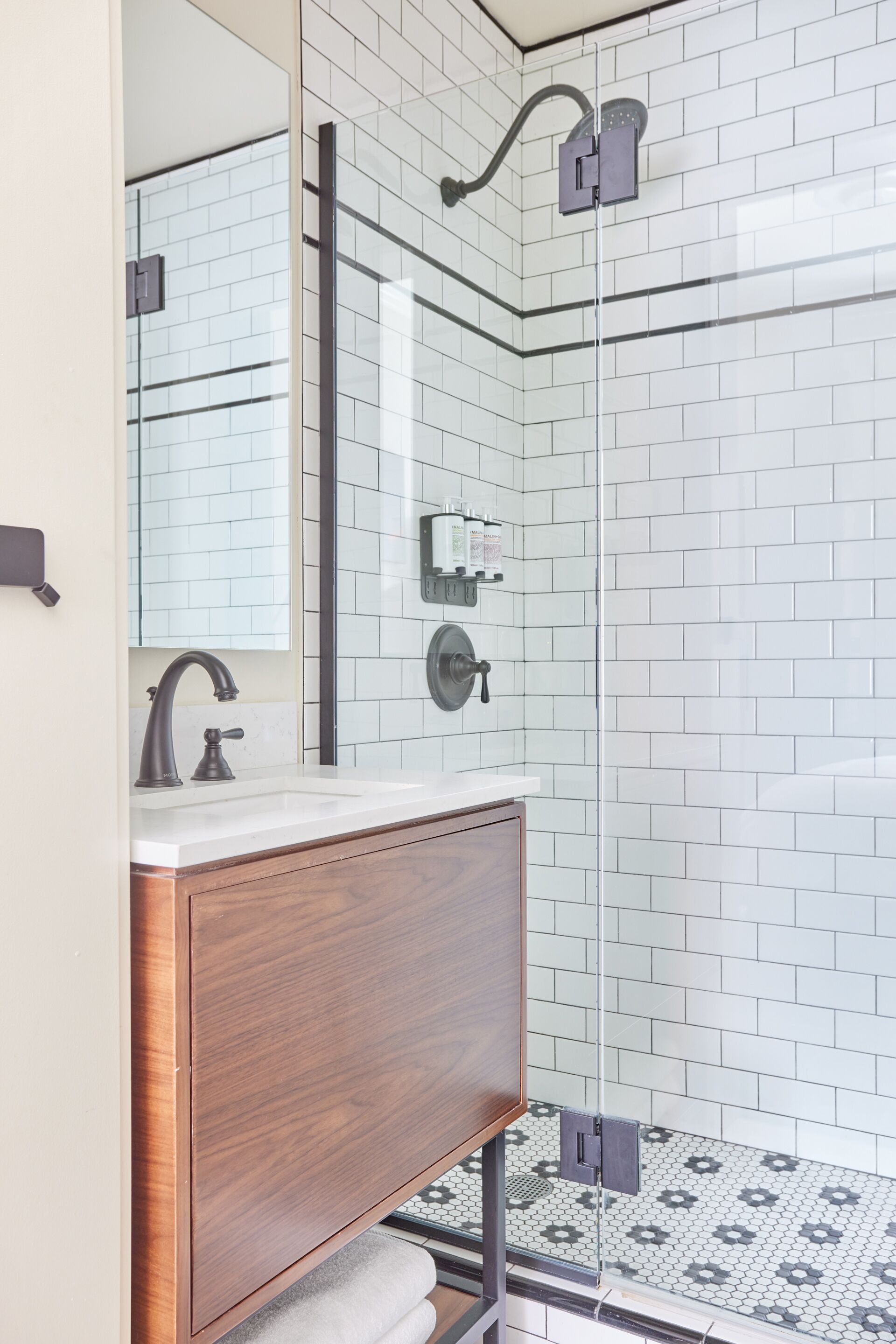 shower, designer toiletries, hair dryer, towels