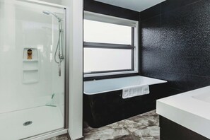 Bathtub, hair dryer, towels, soap