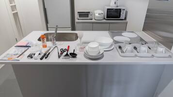 Fridge, microwave, stovetop, cookware/dishes/utensils