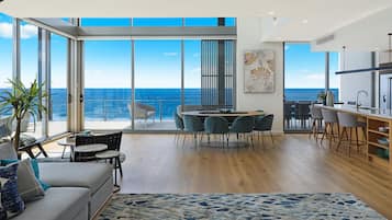 Penthouse, 4 Bedrooms | Living area | 42-inch TV with digital channels