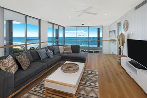 Penthouse, 4 Bedrooms | Living area | 42-inch TV with digital channels