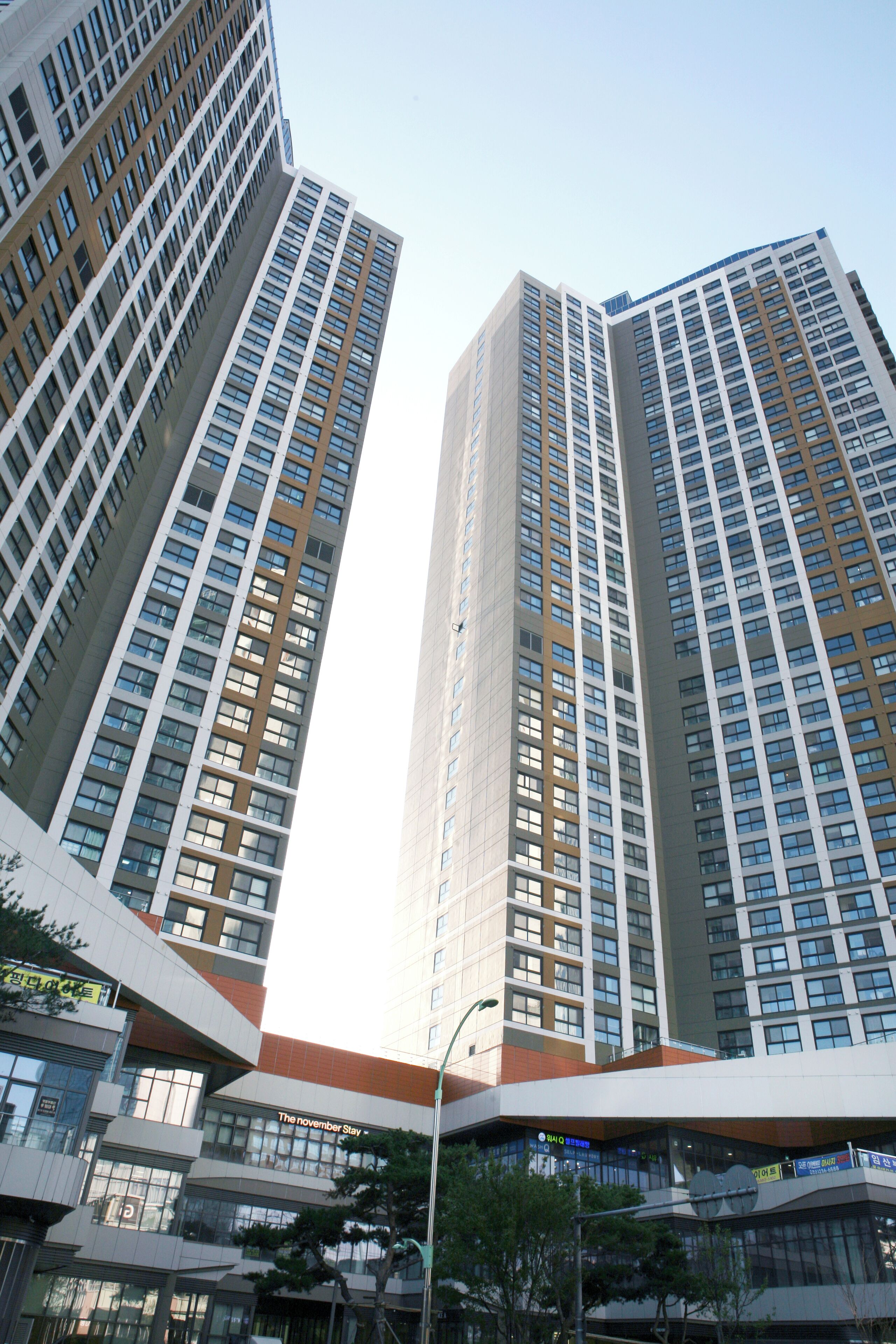A high-rise building with multiple floors, large windows, and a modern architectural design.