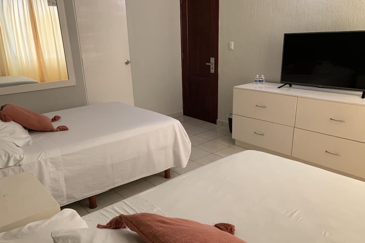 Standard Quadruple Room | Laptop workspace, blackout drapes, iron/ironing board (on request)