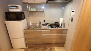 Fridge, microwave, stovetop, cookware/dishes/utensils
