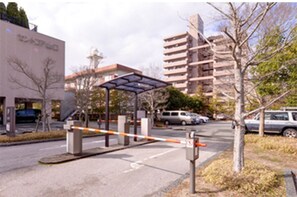 Enter a secure residential area with a modern building at its center.