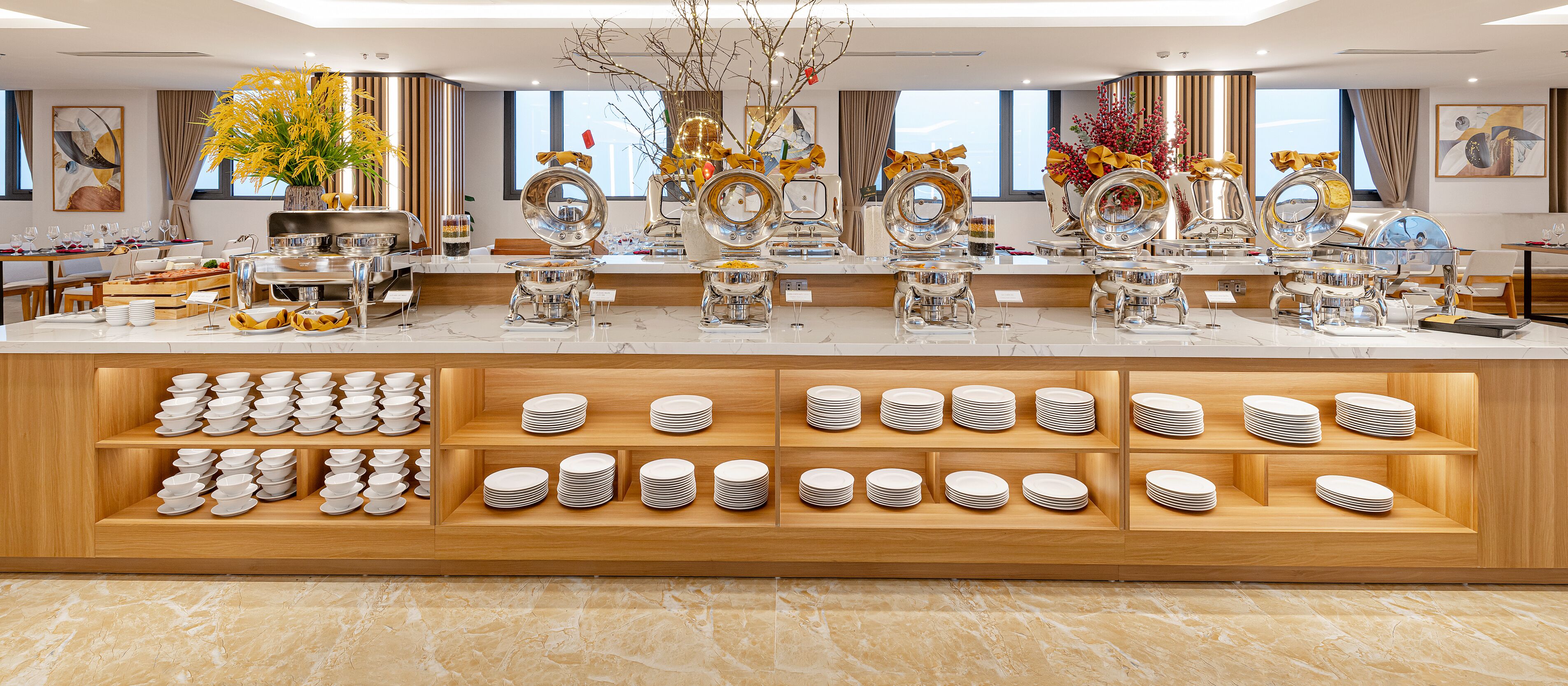 A buffet setup with multiple serving stations, a variety of dishes, and a well-organized layout.