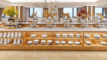 A buffet setup with multiple serving stations, a variety of dishes, and a well-organized layout.