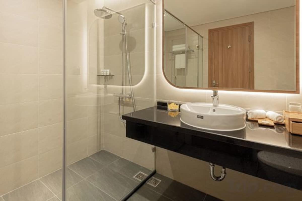 Bathroom | Hair dryer, bathrobes, slippers, towels