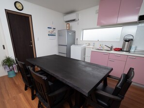 Fridge, microwave, cookware/dishes/utensils, dining tables