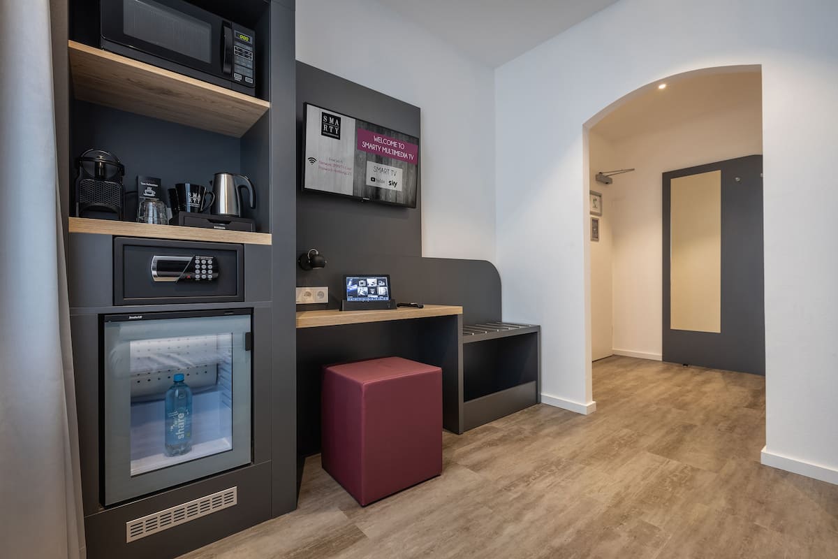 compact double room | living area | 32-inch flat-screen tv with cable channels, tv, tablet