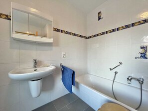 Shower, hair dryer, towels, toilet paper