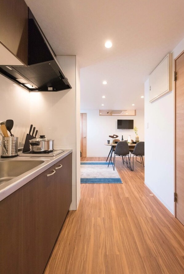 Fridge, microwave, electric kettle, cookware/dishes/utensils