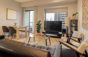 Design Apartment, 1 Bedroom | Living area | Flat-screen TV