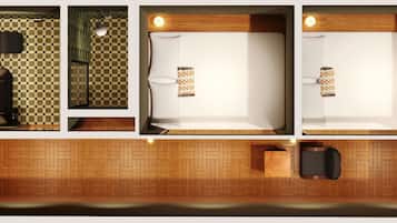 A hotel room layout with a checkered floor, a bed, a small seating area, and a kitchenette.