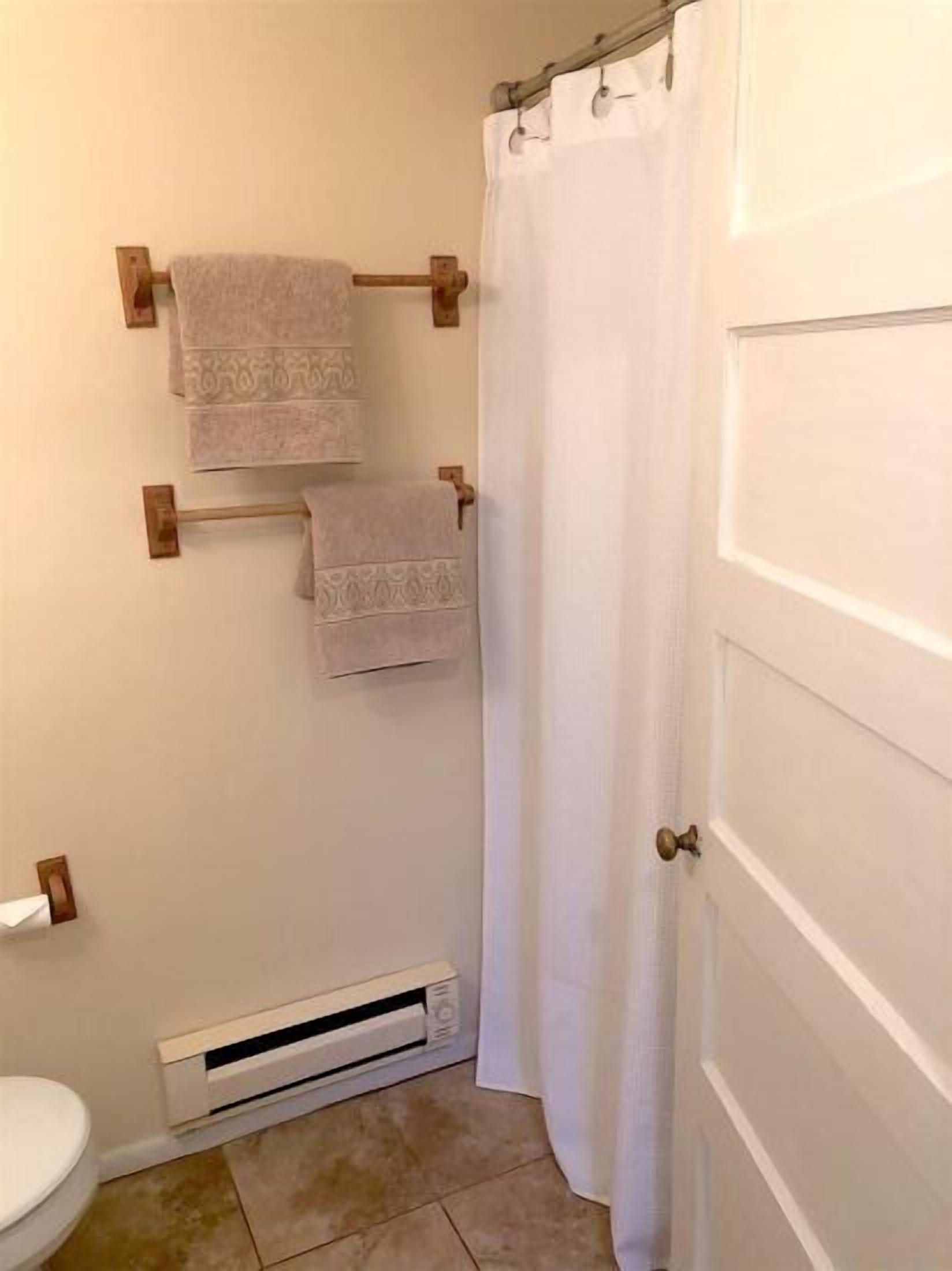 The full size bathroom features a tub/shower combo