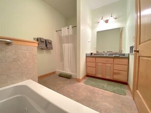 Shower, jetted tub, hair dryer, towels