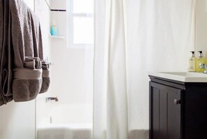 Bathtub, hair dryer, towels