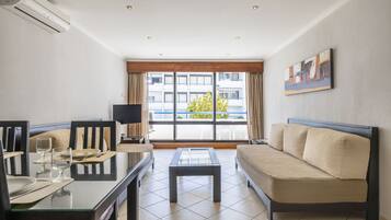 Apartment, 1 Bedroom | Living area | 50-cm flat-screen TV with cable channels, TV