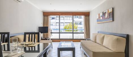 Apartment, 1 Bedroom | Living area | 50-cm flat-screen TV with cable channels, TV