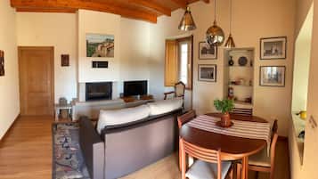 Basic Apartment, 2 Bedrooms | Living area | 50-cm flat-screen TV with cable channels, TV, fireplace