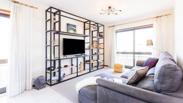 Apartment, 2 Bedrooms | Living area | 50-cm flat-screen TV with cable channels, TV