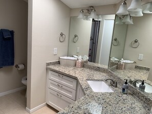 Shower, towels, soap, toilet paper
