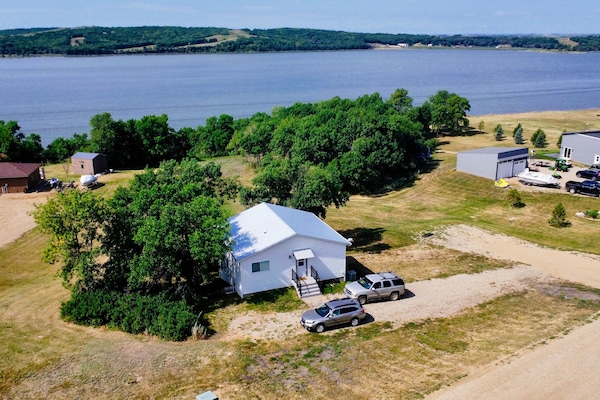 Ariel view. There is an ATV/walking path cut into the trees for lake access.