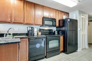 Fridge, microwave, stovetop, coffee/tea maker