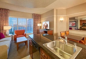 Enjoy city views from the large window, relax in the seating area, and cook meals in the kitchenette.