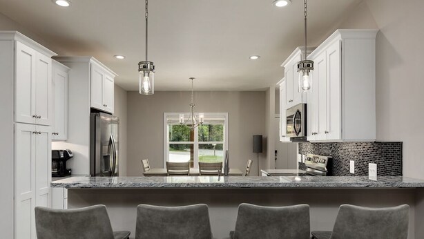 A modern kitchen with white cabinets, a granite countertop, and three grey bar stools. - Serenity on Pinehurst No 6! <3.5 miles to the Village of Pinehurst! Sleeps 10! (Pine Hurst)