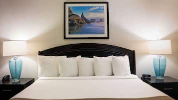 Premium bedding, down comforters, blackout drapes, iron/ironing board