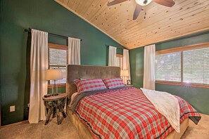 A bedroom with a bed, a ceiling fan, and a window with blinds. - Deck + Yard: Family-Friendly Pinetop Retreat (Pinetop)
