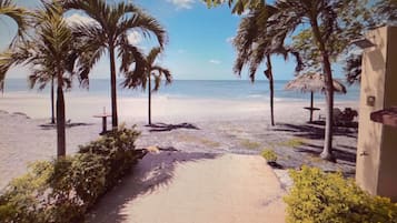 On the beach, sun loungers, beach towels